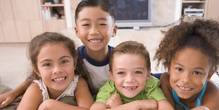 4 grade school kids smiling 