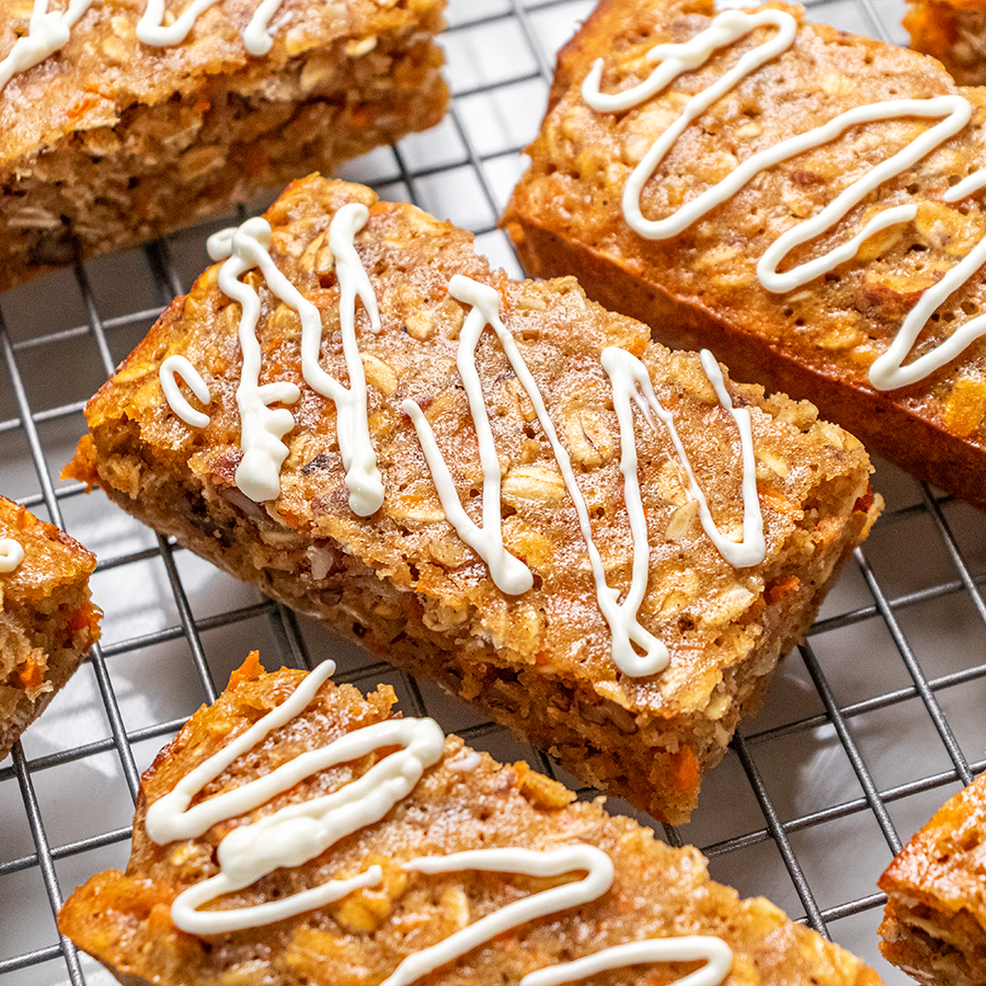 top view of carrot cake breakfast bars on a gray wire rack