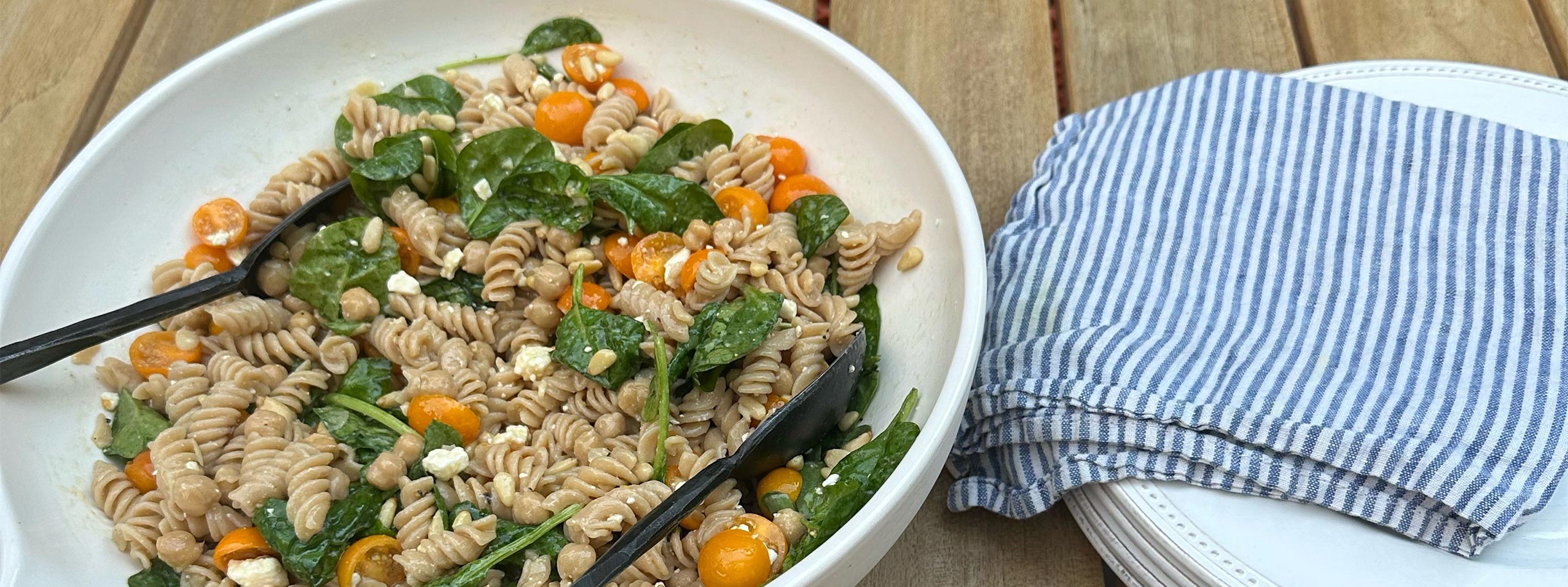 white bowl filled with Lemony Loaded Pasta Salad