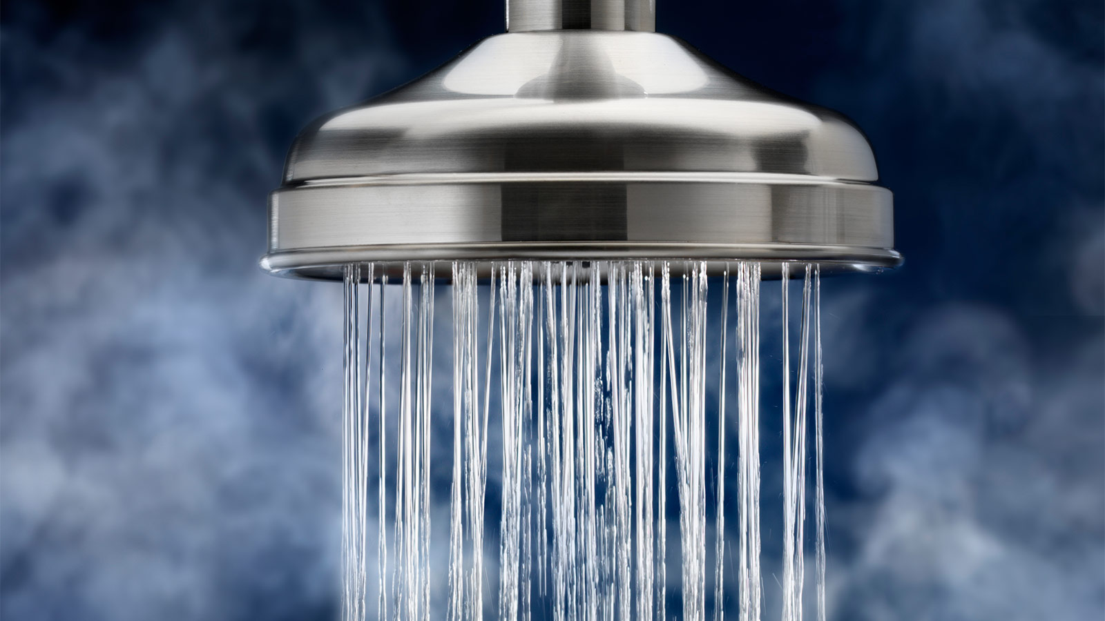 A closeup of water coming out of a shower head
