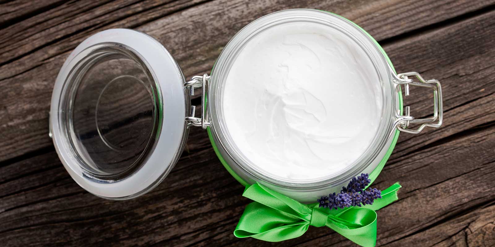 top view of jar containing white lotion like substance