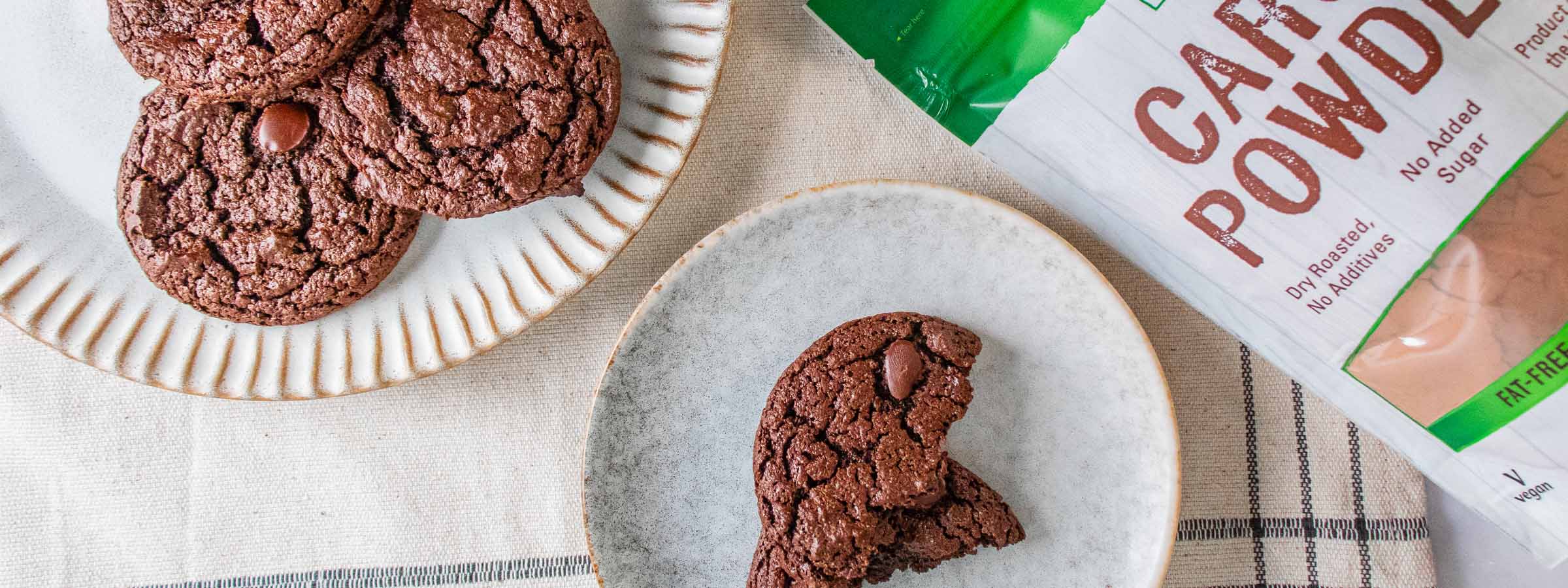top view of carob brownie cookies next to bag of NOW Carbo powder