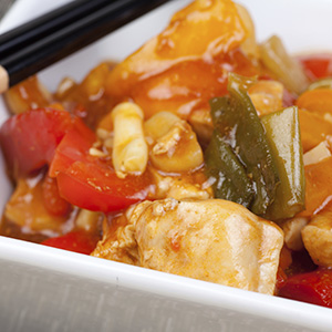 A closeup of a dish of Healthy Sweet-and-Sour Chicken with Organic Quinoa