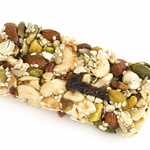 A closeup of a Holy Omega Granola Bar placed on a white background