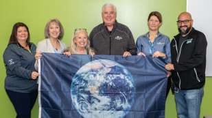 Earth Day 2022 - NOW Team holding flag