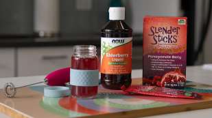 Elderberry Liquid, Pomegranate Berry Slender Stick and small glass jar with red liquid inside