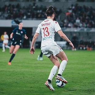 Morgan Gautrat running with soccer ball