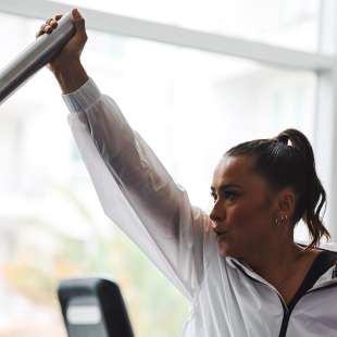 Ali Riley working out in gym