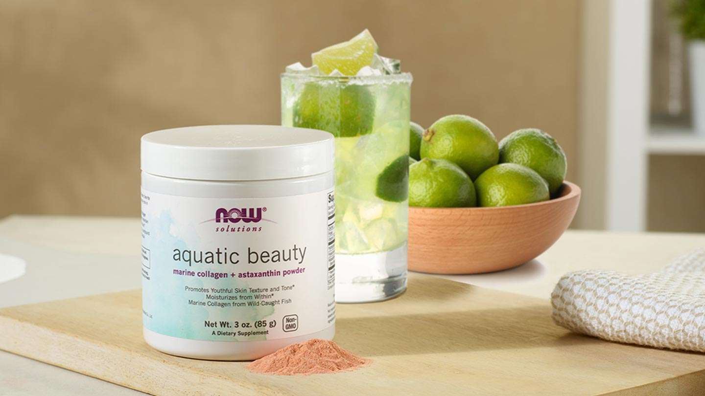 aquatic beauty powder with glass of limeaid and bowl of limes