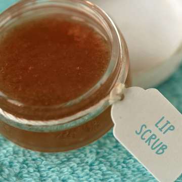 jar of lip scrub on a teal towel 