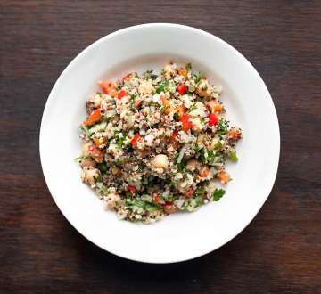 white bowl of mixed quinoa salad