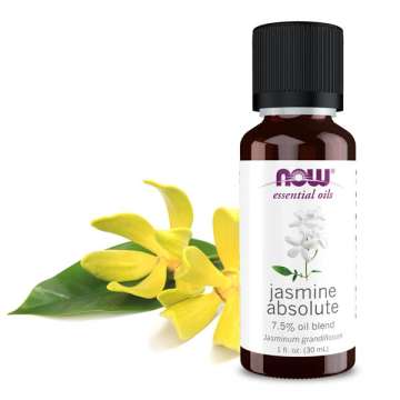 NOW Solutions Jasmine Absolute Oil with yellow flowers behind the bottle