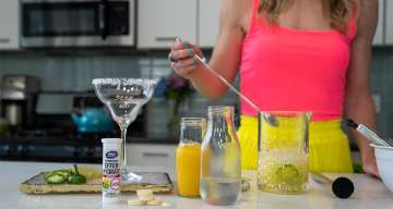 DJ Blatner in her kitchen mixing a drink