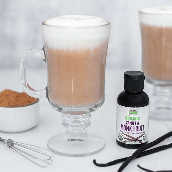 glass cup of vanilla espresso hot cocoa with bottle of Vanilla Monk Fruit sweetener on the right