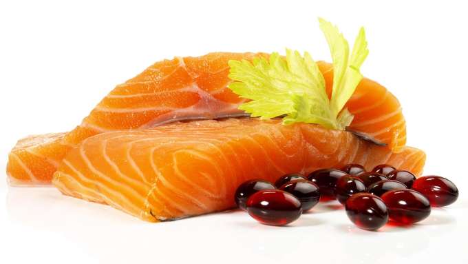 raw salmon filets and Astaxanthin pills 