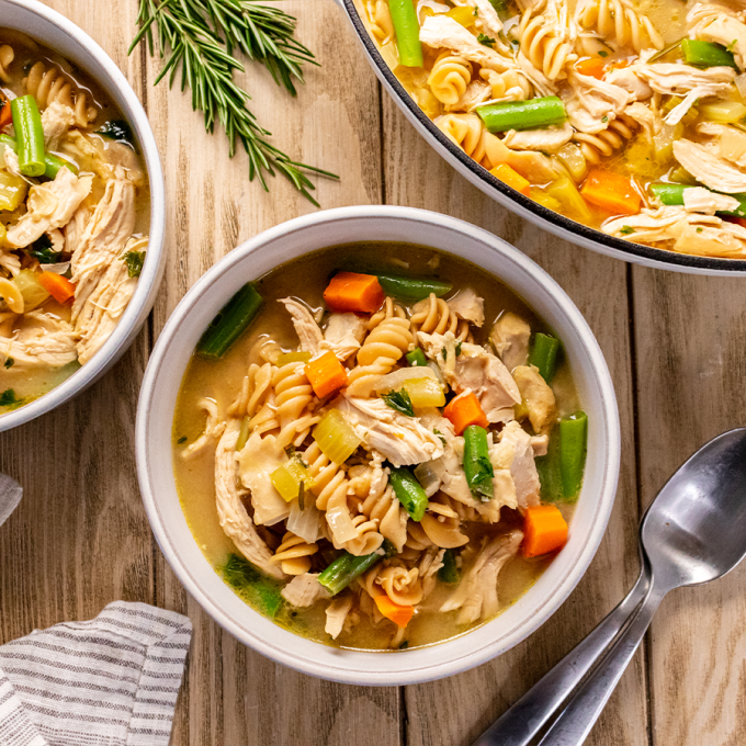 top view of bowl of chicken vegetable noodle soup