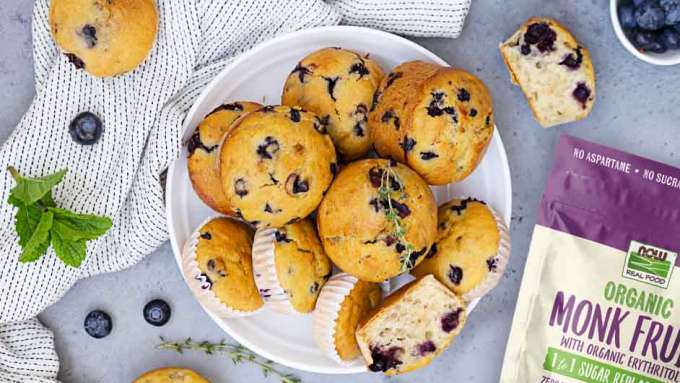 top view of a plate of blueberry muffins next to NOW Mont Fruit pouch