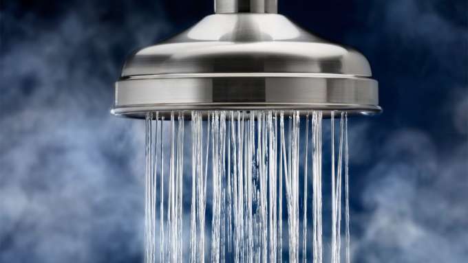 A closeup of water coming out of a shower head