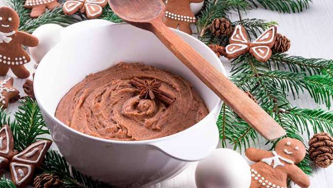 a bunch of gimgerbread cookies around a bowl of gingerbread sugar scrub