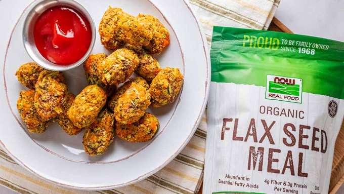 top view of Flax Seed Veggie Tots on a white plate and next to a bag of NOW Flax Seed Meal