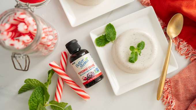 top view of Peppermint Cookie Panna Cotta next to some candy cane and BetterStevia Peppermint Cookie