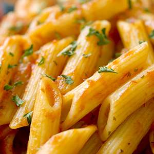 A closeup of a serving of Sundried Tomato Herbed Pasta