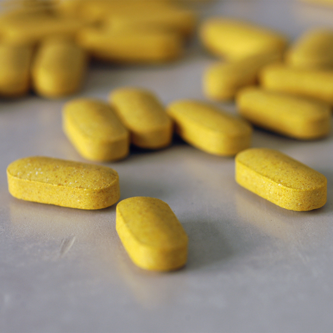 Yellow colored tablets on a table
