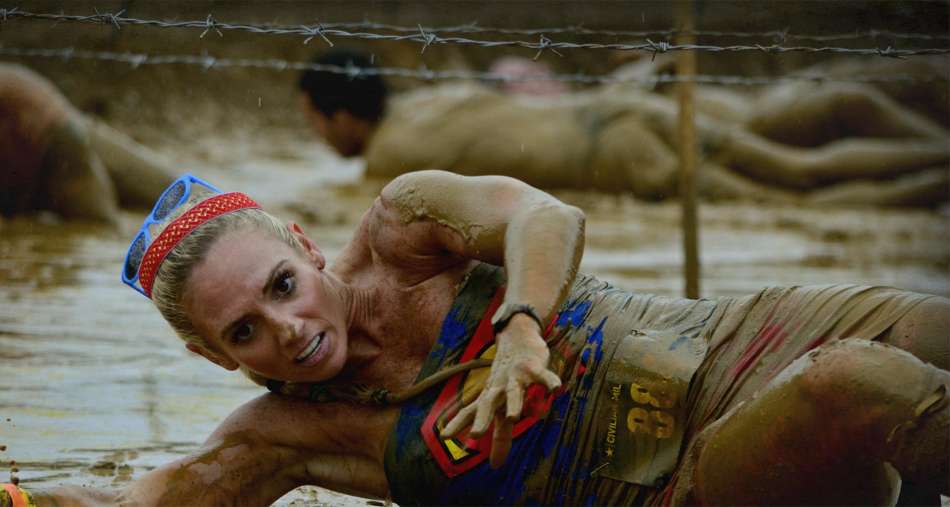 Madeline Dolente Covered in Mud sliding under barbed wire