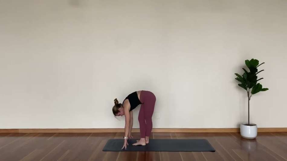 female presenting person doing a standing toe touch