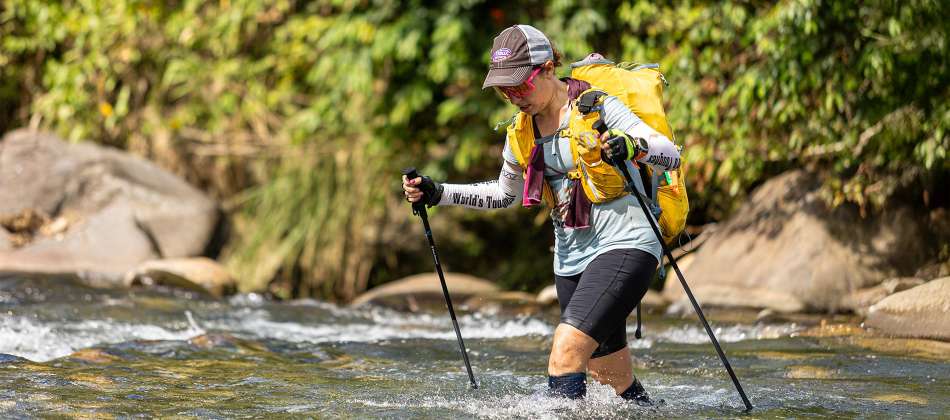 Rachel hiking through a river