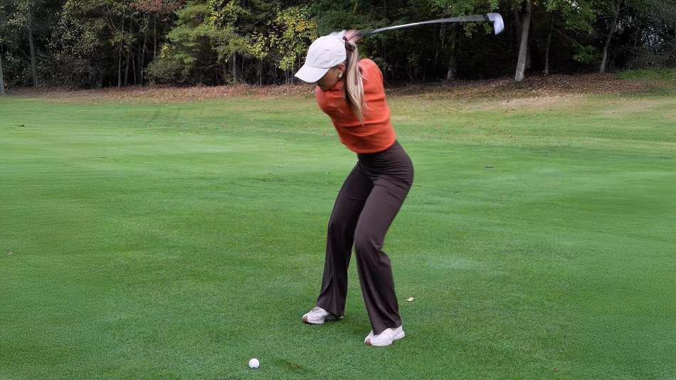 Sydney Grimes mid Golf swing