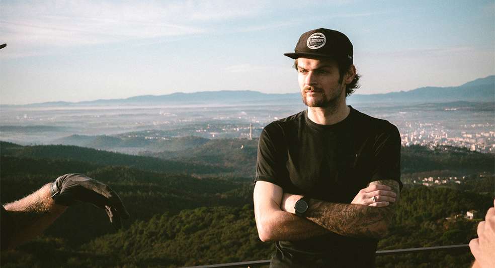 Reid Burrows standing with arms crossed