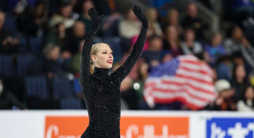 Bradie Tennell waving her hands on the ice